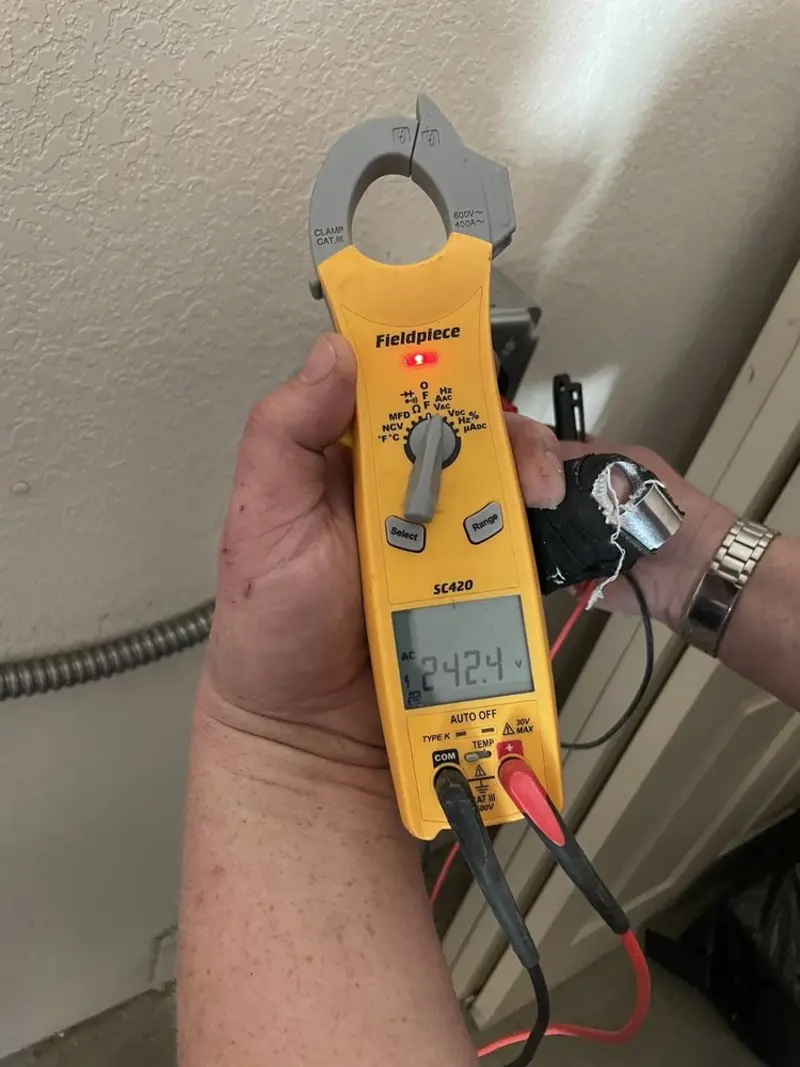 Voltage testing with clamp meter during Electrical Installation Services in Marina